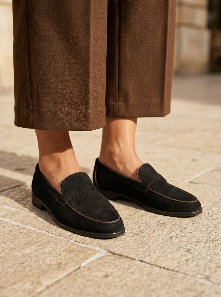 WORKSHOP Leonie Black — suede-texture penny loafers, contrasting tan piping, styled product view