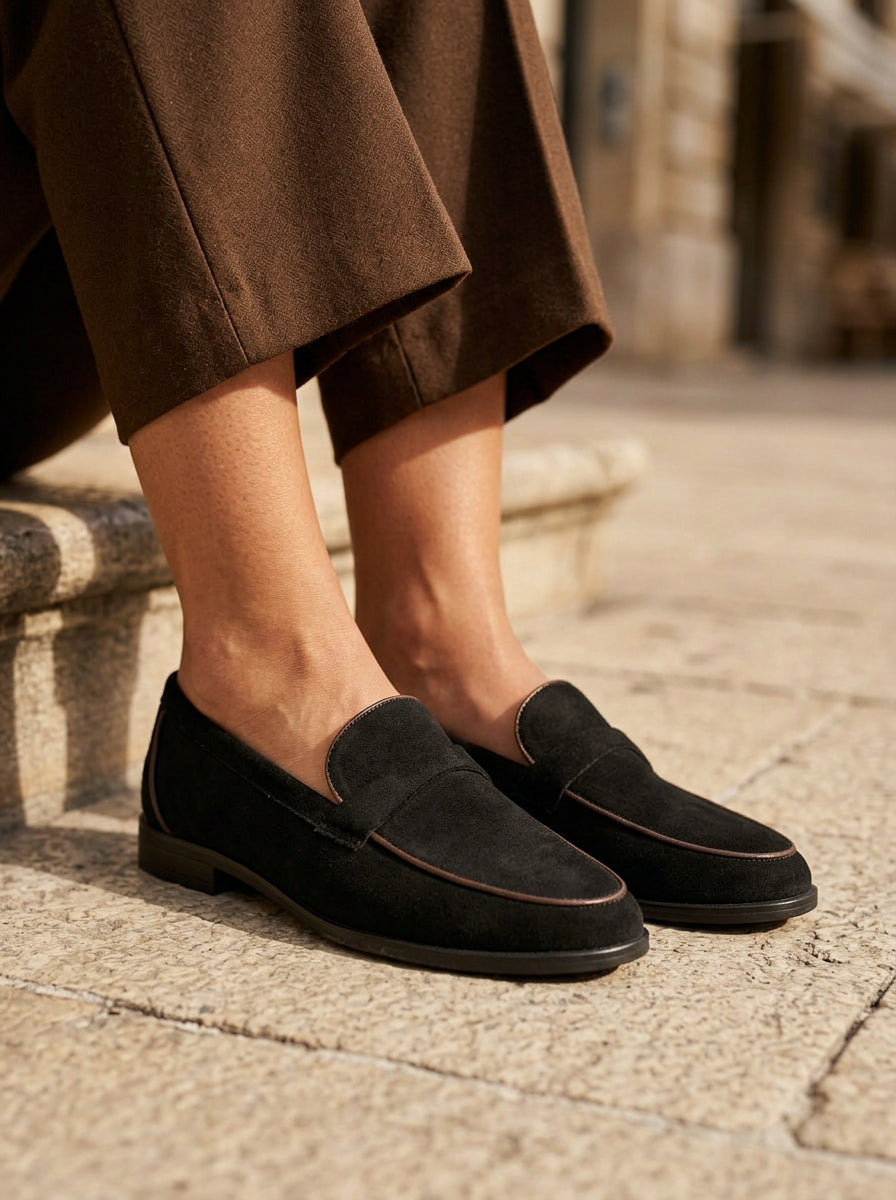 WORKSHOP Leonie Black — suede-texture penny loafers, contrasting tan piping, styled product view