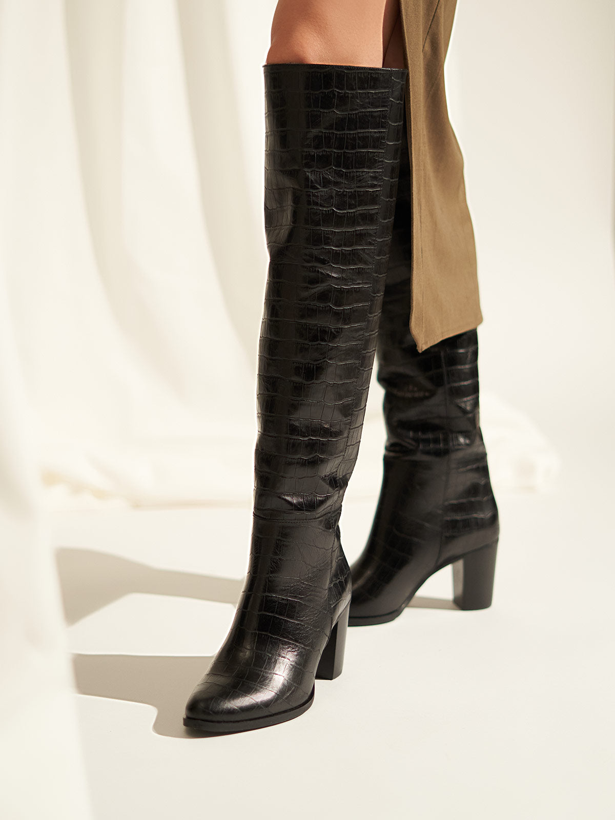 Block heel leather boots in black croco
